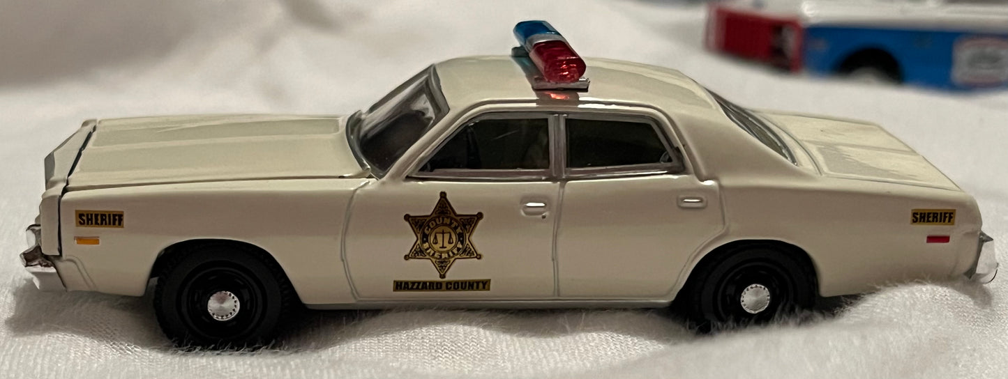 1:64 1977 Plymouth Fury - Hazzard County Sheriff (exclusief hobby)